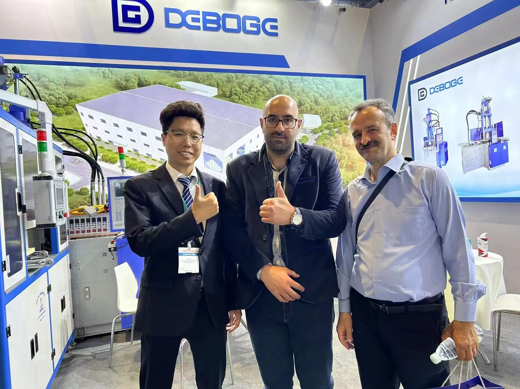 Deboge representative shaking hands with a customer at the factory