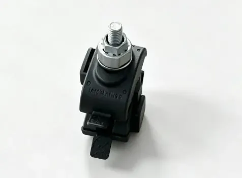 Assembled black insulation piercing connector with visible threaded metal hardware