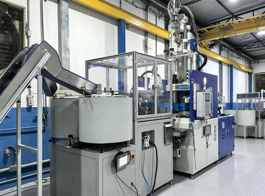 Vibratory bowl feeding equipment and robotic handling at a connector molding machine